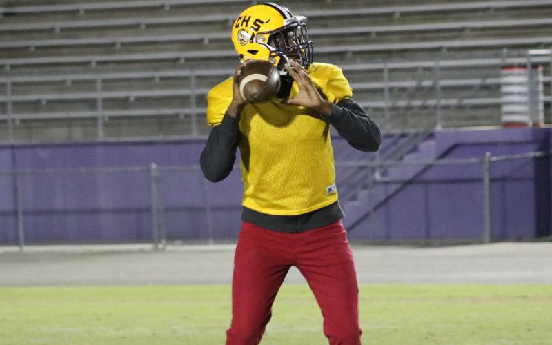 Columbia quarterback Marcus Peterson drops back to pass during Tuesday’s practice. (JORDAN KROEGER/Lake City Reporter)