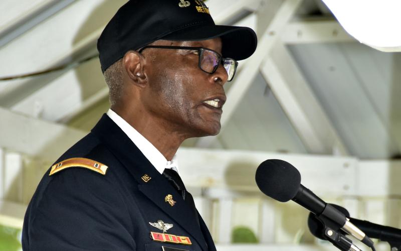 Robert Ford, who spent 26 years in the U.S. Army, said the ending of the pledge of allegiance is a promise that will guide the nation to ‘real liberty and justice for all’ during the Veterans Day ceremony. (ROB WOLFE/Special to the Reporter)