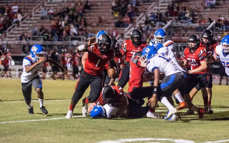 Fort White quarterback Tyler Jefferson scrambles for yardage against Taylor County on Oct. 2. (CHRISTINA FEAGIN/Special to the Reporter)