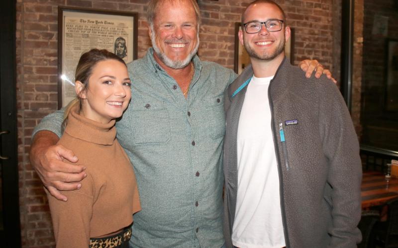 Emilee Southwell (from left), Robby Hollingsworth and Zach Hollingsworth take a break from an election victory dinner Tuesday night after Robby Hollingsworth was elected the Columbia County Commission District 3 representative. (TONY BRITT/Lake City Reporter)