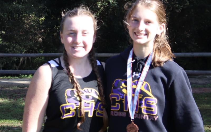 Columbia runners Mackenzie Conklin (left) and Audrey Fender (right) both qualified for next week's Region 1-3A Meet. (SHELBY CONLIN/Special to the Reporter)