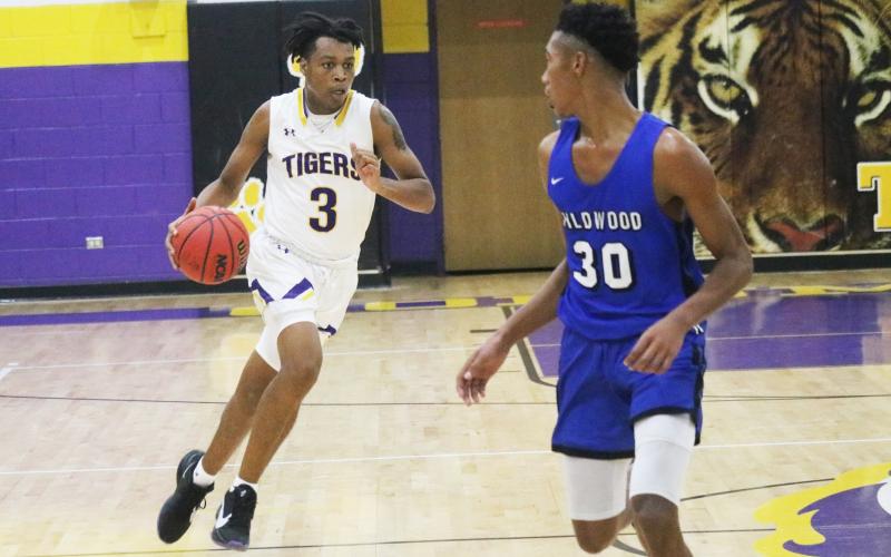 Columbia forward Charleston Ponds pushes the ball up the floor against Wildwood during Tuesday’s preseason game. (JORDAN KROEGER/Lake City Reporter)