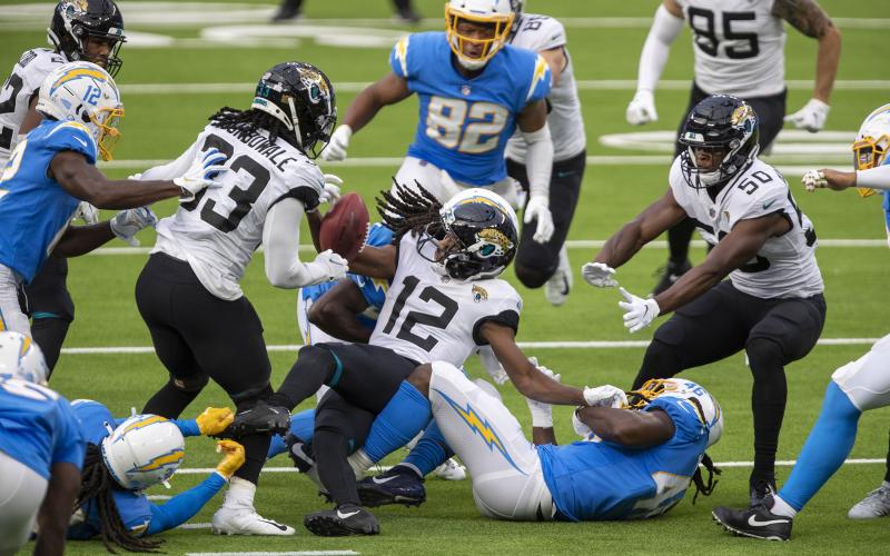 The Los Angeles Chargers' Tevaughn Campbell (37) forces the Jacksonville Jaguars' Dede Westbrook (12) to fumble on a second-half kick return at SoFi Stadium on Oct. 25 in Inglewood, California. The Chargers won, 39-29. (ALLEN J. SCHABEN/Los Angeles Times/TNS)