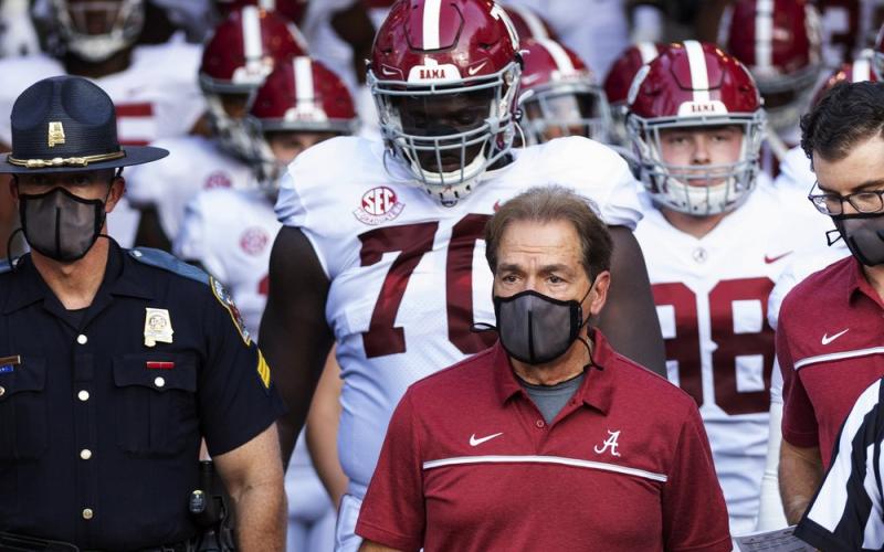 Alabama coach Nick Saban leads his team to the field before a against Missouri on Sept. 26 in Columbia, Mo. Alabama is No. 1 in The Associated Press college football poll for the first time this year, extending its record of consecutive seasons with at least one week on top of the rankings to 13. (AP FILE PHOTO)