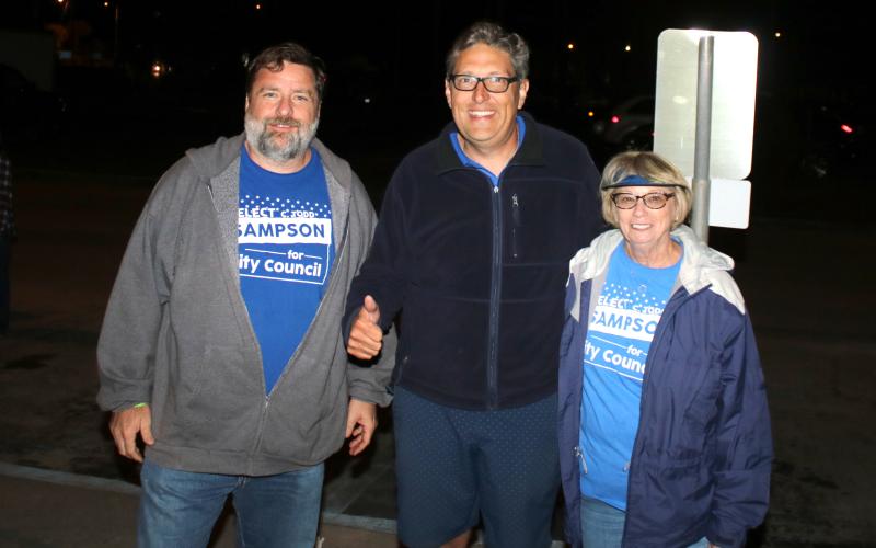 Todd Sampson (center) stands with supporters after he was elected to city council District 13 seat by less than 40 votes Tuesday night. (TONY BRITT/Lake City Reporter)