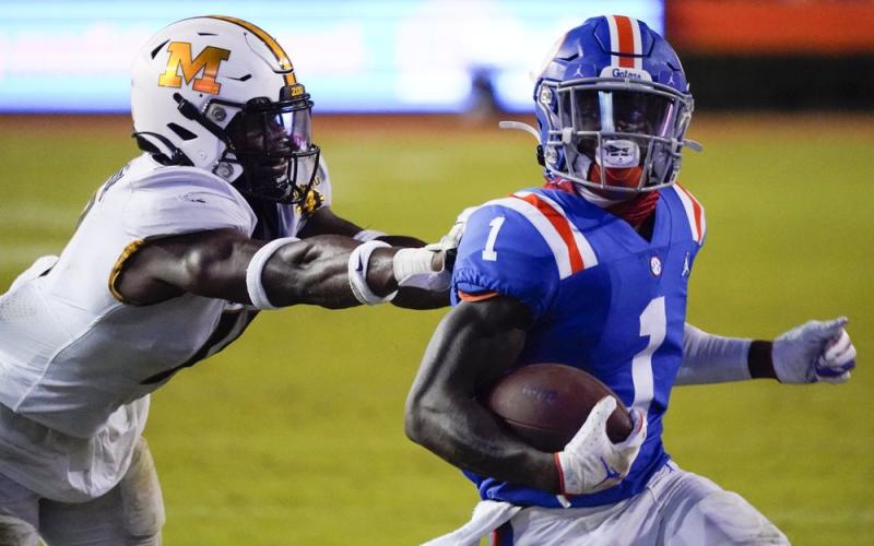 Florida wide receiver Kadarius Toney (1) runs for a 16-yard touchdown as he gets past Missouri linebacker Devin Nicholson on Satuirday in Gainesville. (JOHN RAOUX/Associated Press)