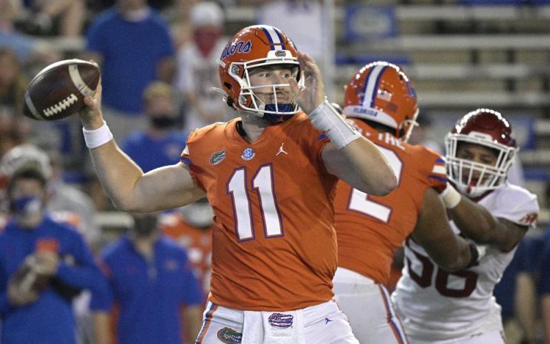 Florida quarterback Kyle Trask (11) looks to throw a pass against Arkansas in Saturday in Gainesville. (PHELAN M. EBENHACK/Associated Press)