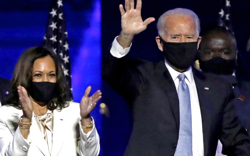 Vice-President-elect Kamala Harris and President-elect Joe Biden celebrate with supporters after declaring victory in the presidential election at the Chase Center in Wilmington, Delaware, on Saturday. (CAROLYN COLE/Los Angeles Times/TNS)