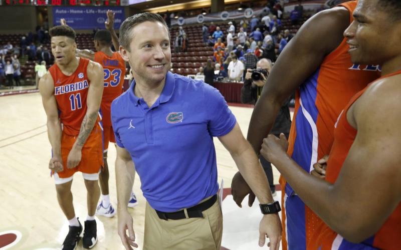 Florida's head coach Mike White celebrates after defeating Xavier 70-65 in the finals of the Charleston Classic on Nov. 24, 2019, in Charleston, S.C. The Gators didn’t have much fun last year. White is eager for his Gators to run and press like never before. Florida is scheduled to open their season on Nov. 25 in Connecticut. (AP FILE PHOTO)