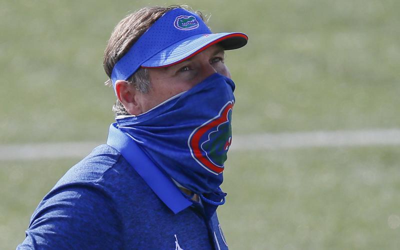 Florida head coach Dan Mullen watches his team warm up prior to a game against Vanderbilt on Nov. 21 in Nashville, Tennessee.  (FREDERICK BREEDON/Getty Images/TNS)