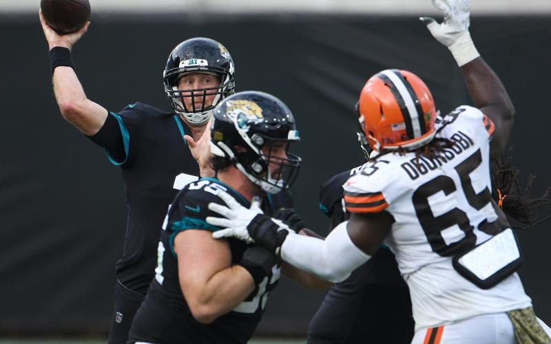 Jacksonville Jaguars quarterback Mike Glennon (2) tries to get off a pass under pressure against the Cleveland Browns at TIAA Bank Field on Sunday in Jacksonville. (BOB SELF/TNS)