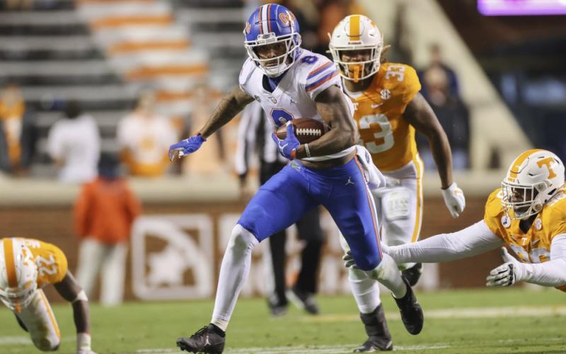 Florida wide receiver Trevon Grimes (8) runs with the ball against Tennessee on Saturday in Knoxville, Tenn. (RANDY SARTIN/Knoxville News Sentinel via AP, Pool)