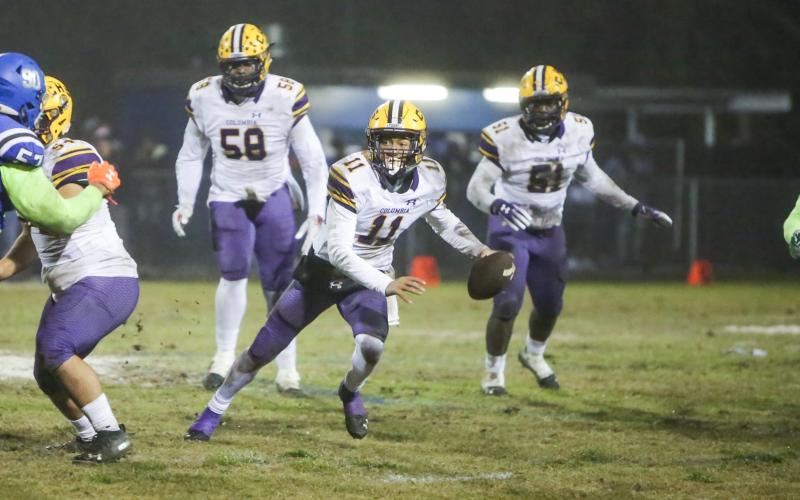 Columbia quarterback Jordan Smith scrambles out of the pocket against Robert E. Lee during Friday’s Region 1-6A semifinal. (BRENT KUYKENDALL/Lake City Reporter)