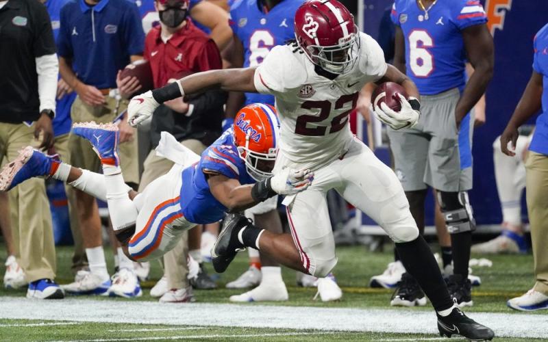 Florida linebacker Mohamoud Diabate (11) hits Alabama running back Najee Harris (22) during the second half of the Southeastern Conference championship on Saturday in Atlanta. (JOHN BAZEMORE/Associated Press)