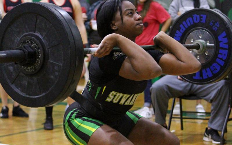 Suwannee’s Tyra Kalandyk lifts during the clean and jerk portion of a meet last season at Suwannee High School. SHS hosts its annual Power of Christmas event today. (PAUL BUCHANAN FILE/Special to the Reporter)