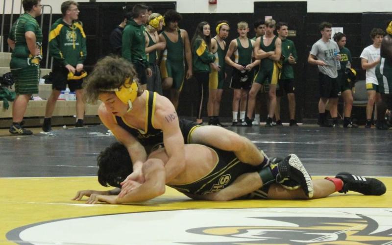 Columbia’s Brett Millard wrestles against Buchholz in a preseason match last month. (COURTESY)