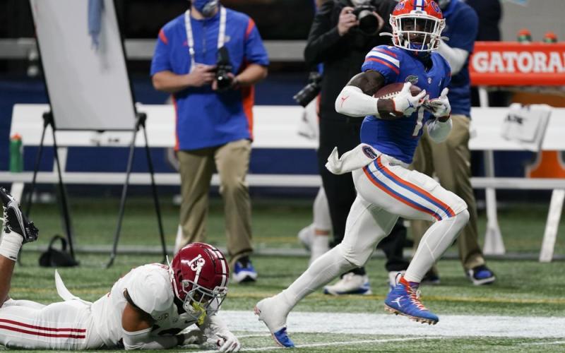 Florida wide receiver Kadarius Toney (1) runs for a touchdown after a catch during the first half of the Southeastern Conference championship game against Alabama on Dec. 19 in Atlanta. (JOHN BAZEMORE/Associated Press)