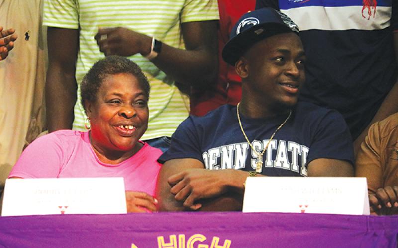 Columbia receiver TJ Jones is pictured with his grandmother Barbara Jernigan after signing his National Letter of Intent with Penn State on Wednesday. (ERIC JACKSON/Lake City Reporter)