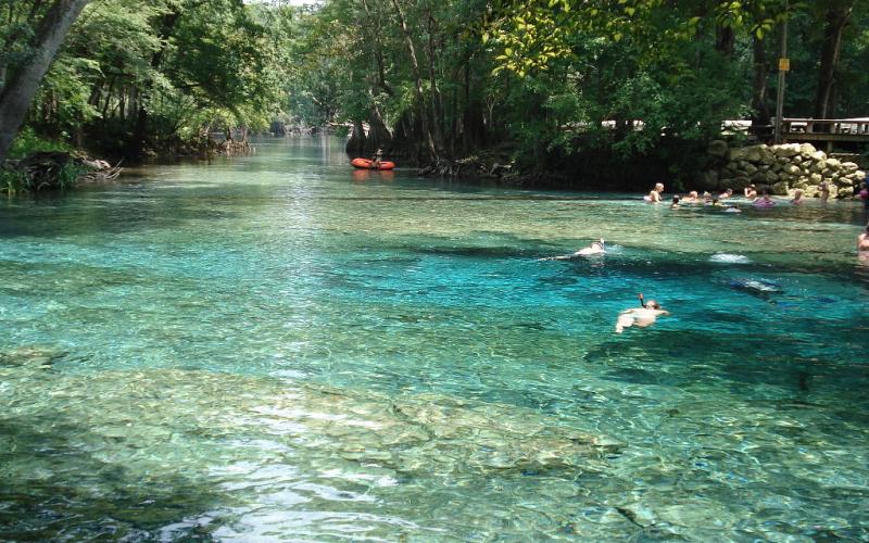People enjoy a day in Ginnie Springs, which is also home to a Nestlé water-bottling plant, which is seeking a renewal of its permit to draw water from the springs. (FILE)