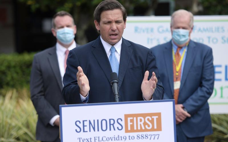 Florida Governor Ron DeSantis addresses the media Monday on the status of covid-19 vaccination rates in the state’s nursing homes and assisted living facilities. (BOB SELF/Florida Times-Union/TNS)
