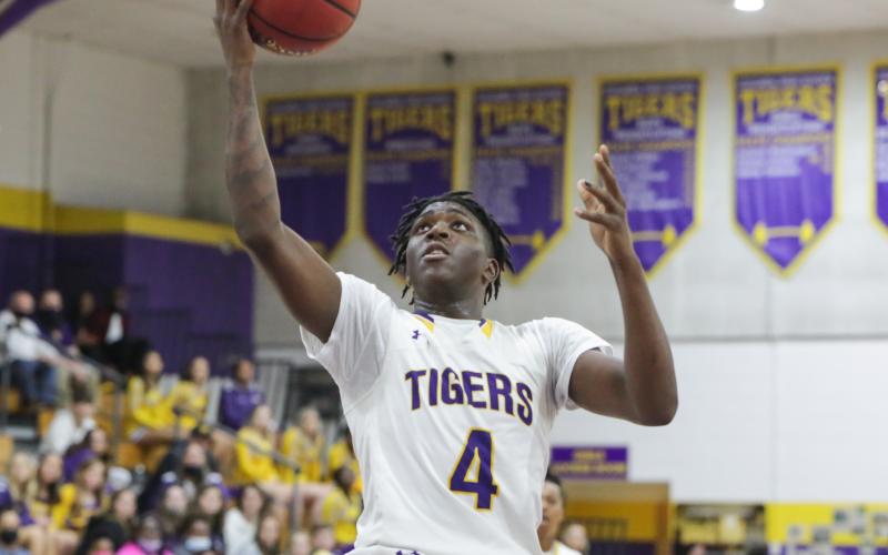 Columbia forward Marcus Peterson rises to score against Baker County on Jan. 22. (BRENT KUYKENDALL/Lake City Reporter)