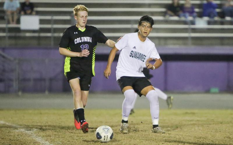 Columbia’s Zack Strickland chases down possession during Tuesday’s match against Suwannee. (BRENT KUYKENDALL/Lake City Reporter)