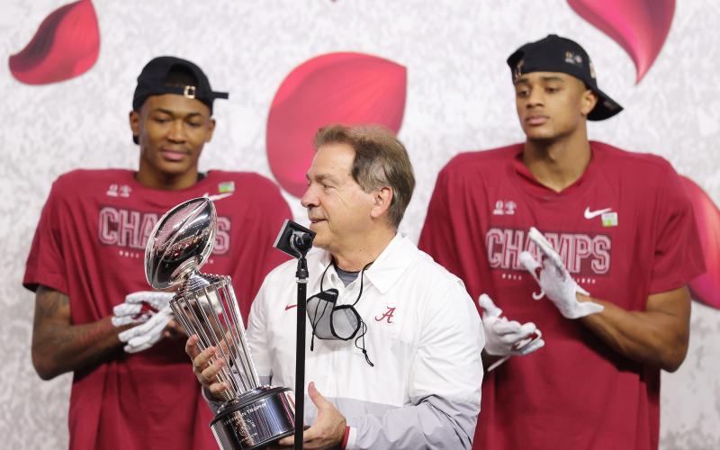 Alabama Crimson Tide coach Nick Saban raises the Leishman Trophy after defeating the Notre Dame Fighting Irish 31-14 in the College Football Playoff Semifinal at the Rose Bowl Game at AT&amp;T Stadium on Jan. 1 in Arlington, Texas. (CARMEN MANDATO/Getty Images/TNS)