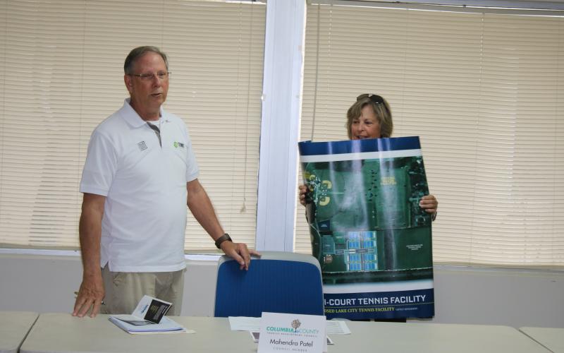 Mike Null and Dolly Robinson from the Lake City Columbia County Tennis Association speak during a presentation Wednesday afternoon at the Columbia County Tourist Development Council meeting. (TONY BRITT/Lake City Reporter)