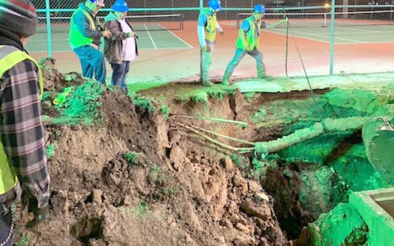 Lake City utility crews worked late into the night Tuesday fixing a water main break at Columbia High School. (COURTESY)