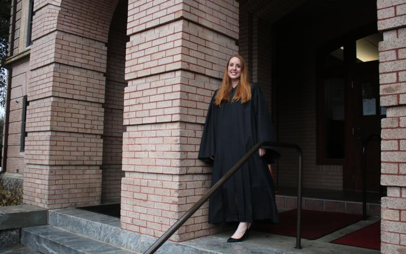 Sara Carter, stands on the steps of the Columbia County Courthouse on Friday afternoon. Carter, 42, has been serving as the Columbia County Court judge for roughly two weeks. (TONY BRITT/Lake City Reporter)