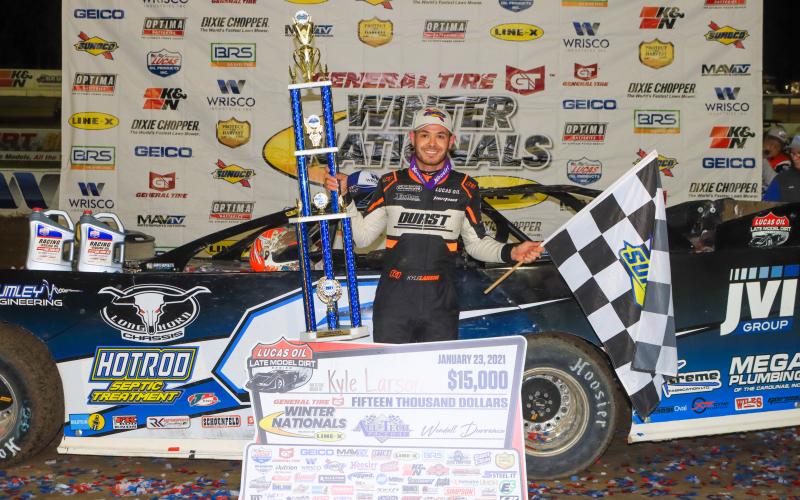 Kyle Larson poses with the first-place trophy after winning the General Tire Winter Nationals at All-Tech Raceway on Saturday night. Larson received a prize of $15,000. (LOVIN’ DIRTY PHOTOGRAPHY )