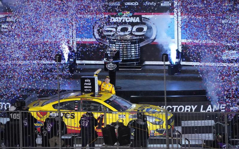 Michael McDowell celebrates in Victory Lane early Monday morning after winning the Daytona 500. (NIGEL COOK/News-Journal/TNS)