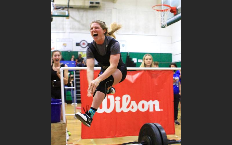 Branford’s Evie Pitts celebrates after finishing her clean and jerk en route to the state title in the 139 class. (PAUL BUCHANAN/Special to the Reporter)