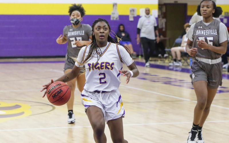 Columbia guard Na’Haviya Paxton pulls up for a shot against Gainesville during Wednesday’s District 2-6A semifinals. (BRENT KUYKENDALL/Lake City Reporter)