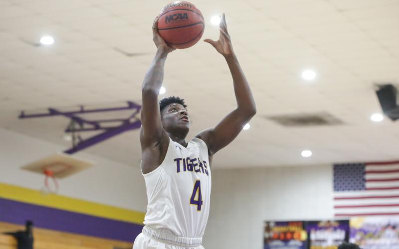 Columbia forward Marcus Peterson goes up for a shot against Santa Fe on Feb. 4.  Peterson scored 32 points in Thursday’s 96-73 win over Tate in the Region 1-6A quarterfinals. (BRENT KUYKENDALL/Lake City Reporter)