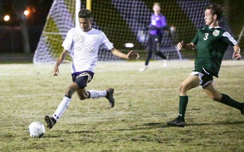 Columbia’s Daniel Lee passes the ball up the field against Lincoln during the District 2-6A championship game on Feb. 8. (BRENT KUYKENDALL/Lake City Reporter)