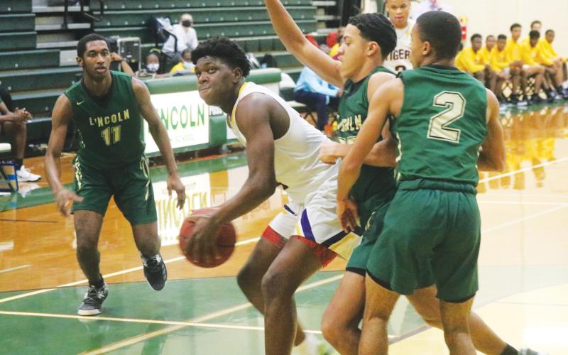 Columbia forward Marcus Peterson looks to shoot against Lincoln during the District 2-6A championship on Feb. 12. (JORDAN KROEGER/Lake City Reporter)