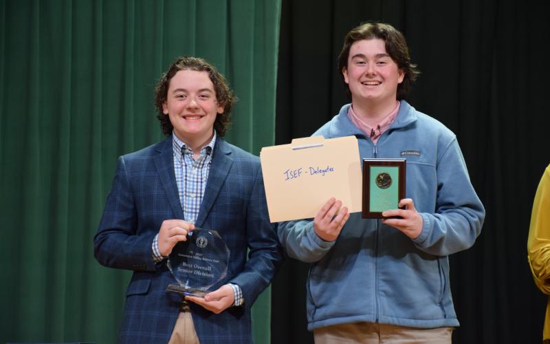 The Suwannee Valley Science Fair was held Thursday at Florida Gateway College with Fort White High School and Fort White Middle School taking home the top honors with the best overall winner in both the junior and senior divisions. Winning the Best Overall Senior Division Award were Fort White’s Trace Taylor (from left) and Trey Tyre for their project, ‘The Effect of a 1% Microflora Inoculant Soil Solution on Cucumber Nutrient Density, Plant Growth, and General Health.’ (COURTESY)