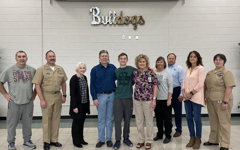 Celebrating Timothy Jolicoeur’s appointment to the United States Military Academy at West Point at Suwannee High on Thursday were teachers and staff that have helped the SHS senior receive that early admission. Those staff and teacher include coach John Wainwright, from left, Senior Chief Patrick Dawson, Tammy Boggus, Jay Jolicoeur (his father as well as science teacher), Jolicoeur, Melinda Griffith, Sandra Hurst, Ronnie Gray, Paula McMillan and Lt. Debra Kleinsmith. (COURTESY)