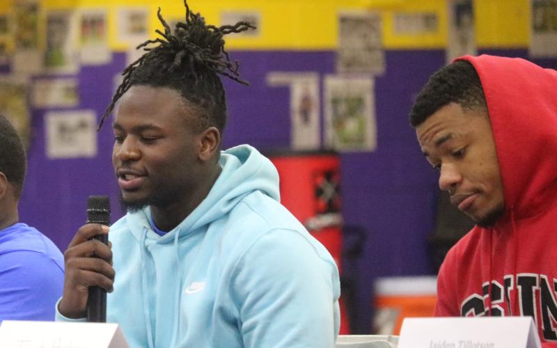 Columbia defensive lineman Tyler Ford (left) announces his decision to sign with St. Andrews on Wednesday. (JORDAN KROEGER/Lake City Reporter)