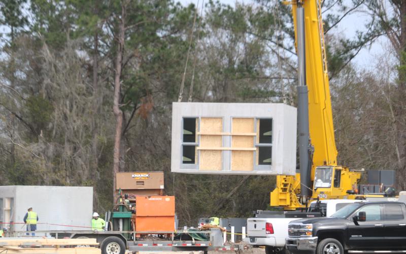 The pre-cast jail cell pods began arriving to the Columbia County Detention Facility this week before being installed with the use of a large crane. (TONY BRITT/Lake City Reporter)