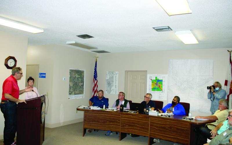 Lake City Councilman Todd Sampson talks to the Fort White Town Council about the city providing utility services to Fort White at a meeting Monday. (TONY BRITT/Lake City Reporter)