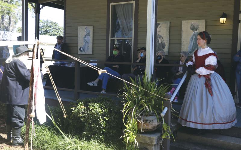 Spectators and volunteers gather to listen to Harry Joiner discuss medical treatments, including bloodletting and amputation, practiced in the Civil War. (MORGAN MCMULLEN/Lake City Reporter)