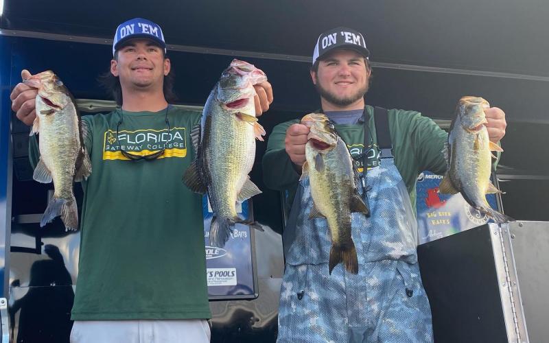 FGC’s Seth Slanker (left) and Jackson Swisher (right) pose with their winning fish at the Florida Bass Nation Bassmaster College Series qualifier on Lake Okeechobee on Saturday. (COURTESY)