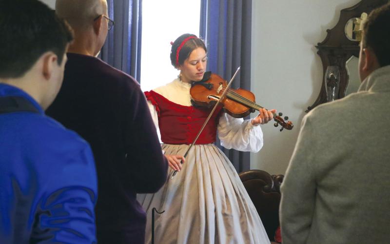 Emily-Jane Curtis, a dual-enrolled student at North Florida Community College, plays Civil War-era songs on her viola during Saturday’s ‘Blast Through the Past’ event at the Lake City-Columbia County Historical Museum. (MORGAN MCMULLEN/Lake City Reporter)