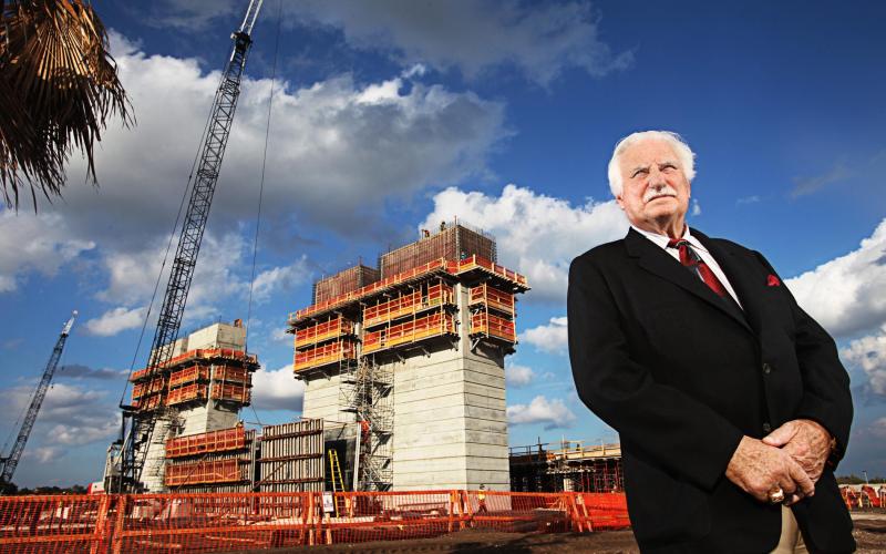 Then Florida Atlantic University football coach Howard Schnellenberger stands in front of the team's new stadium, which was under construction and is now named for him, in 2011. His building of the Owls football program as well as success at Miami and Louisville have earned him the Paul 'Bear' Bryant Lifetime Achievement Award. (POST FILE PHOTO/TNS)