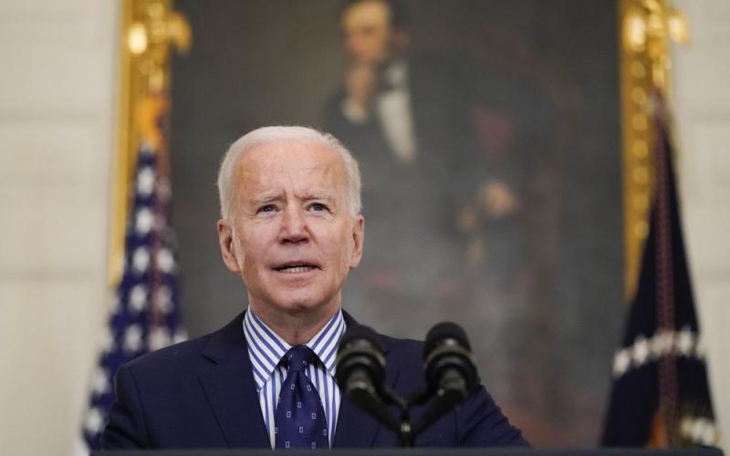 President Joe Biden speaks in the State Dining Room of the White House on Saturday in Washington. The Senate approved a sweeping pandemic relief package over Republican opposition on Saturday, moving Biden closer to a milestone political victory that would provide $1,400 checks for most American and direct billions of dollars to schools, state and local governments, and businesses. (ALEX BRANDON/Associated Press)