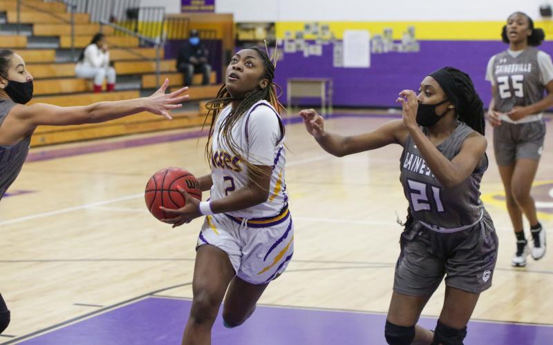 Columbia guard Na'Haviya Paxton drives to the basket to score against Gainesville during the District 2-6A semifinals on Feb. 3. (BRENT KUYKENDALL/Lake City Reporter)