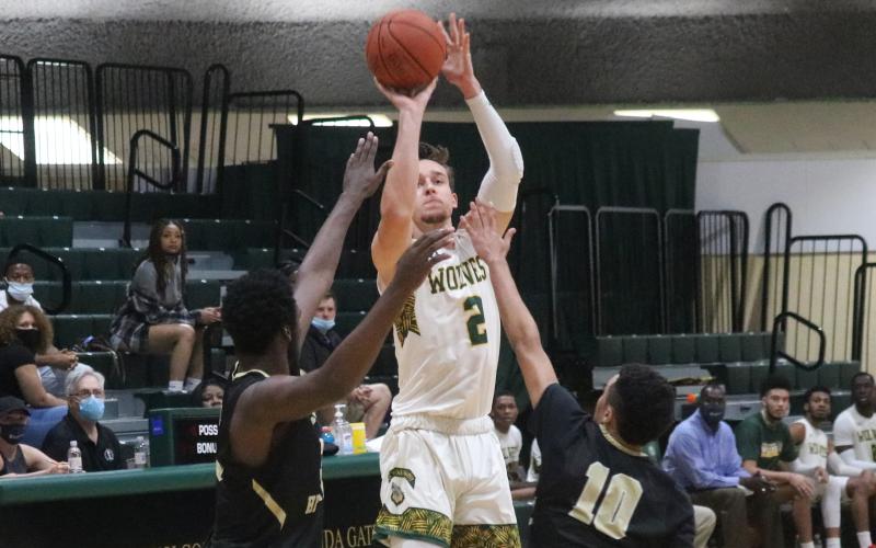 FGC forward Layton Veon fires a jumper against Pasco-Hernando State College during Saturday's FCSAA Region 8 Division II Championship at the Howard Center. (JORDAN KROEGER/Lake City Reporter)