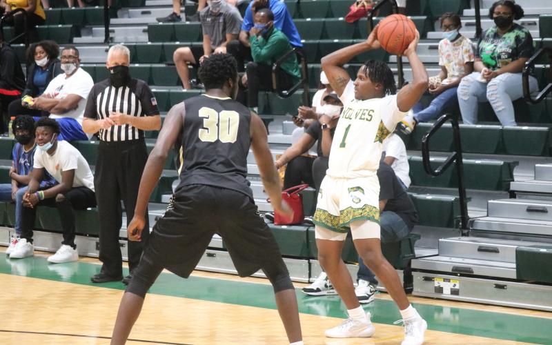 FGC guard Joshua Cross looks to pass against Pasco-Hernando State College during Saturday's FCSAA Region 8 Division II Championship at the Howard Center. (JORDAN KROEGER/Lake City Reporter)